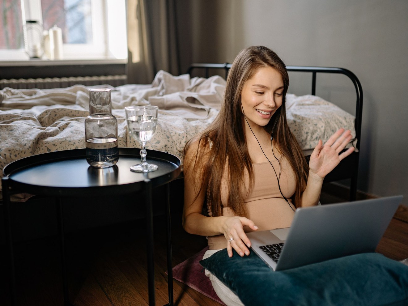 Woman at home reviewing her care plan on a laptop