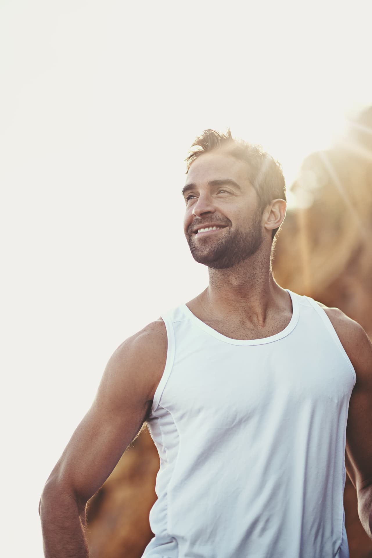 Smiling man outdoors in warm sunlight